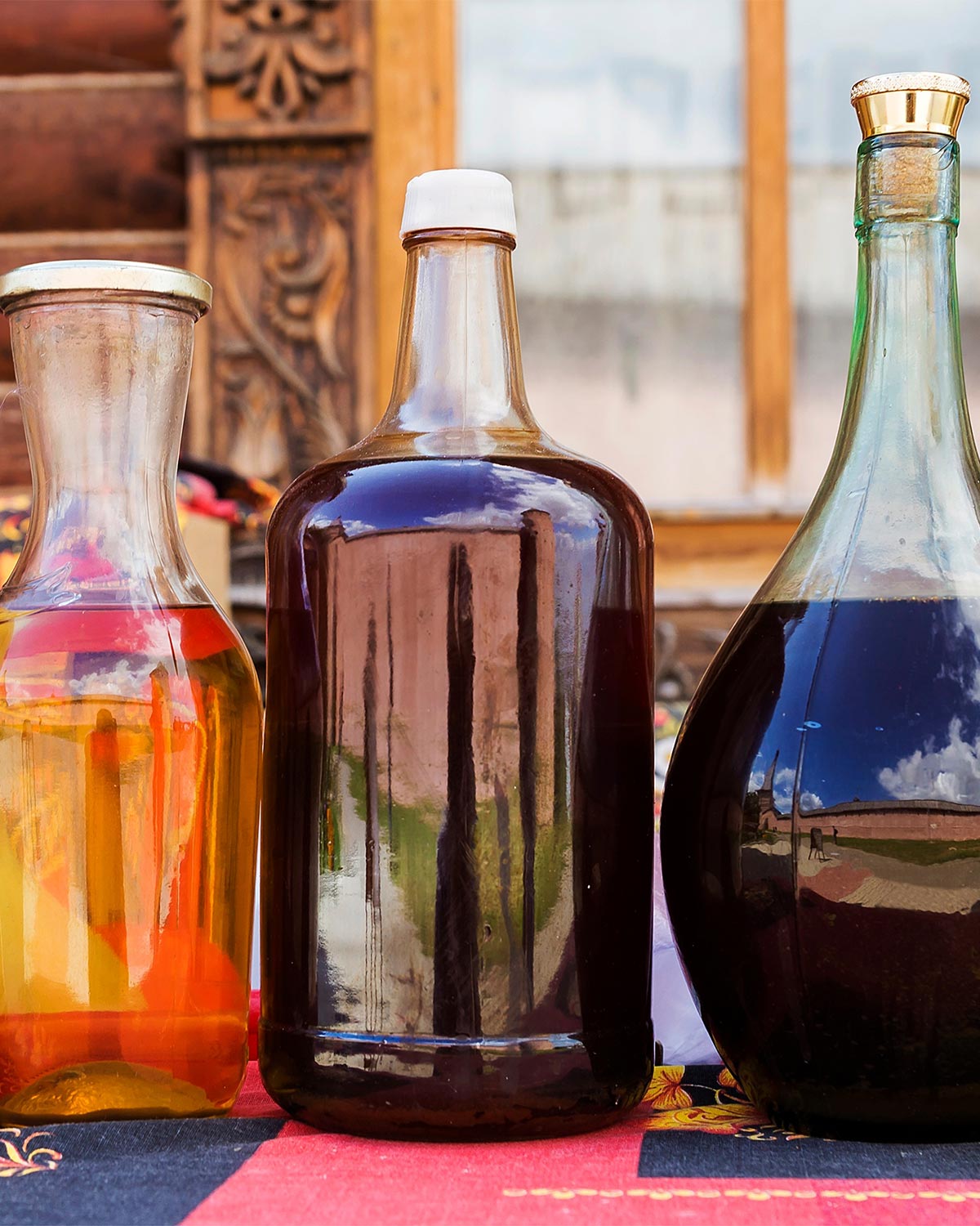 three different jugs containing mead 