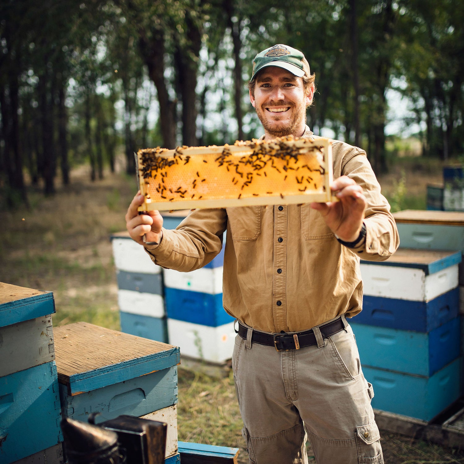 Leo Lockhart displays beehive frame 